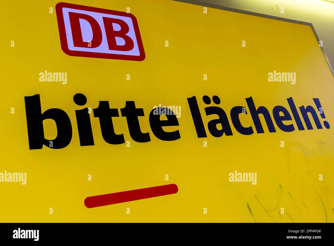 Campaign for friendliness by Deutsche Bahn AG. Smile from here please,  symbol photo. Illuminated poster in Heilbronn main station Stock Photo -  Alamy