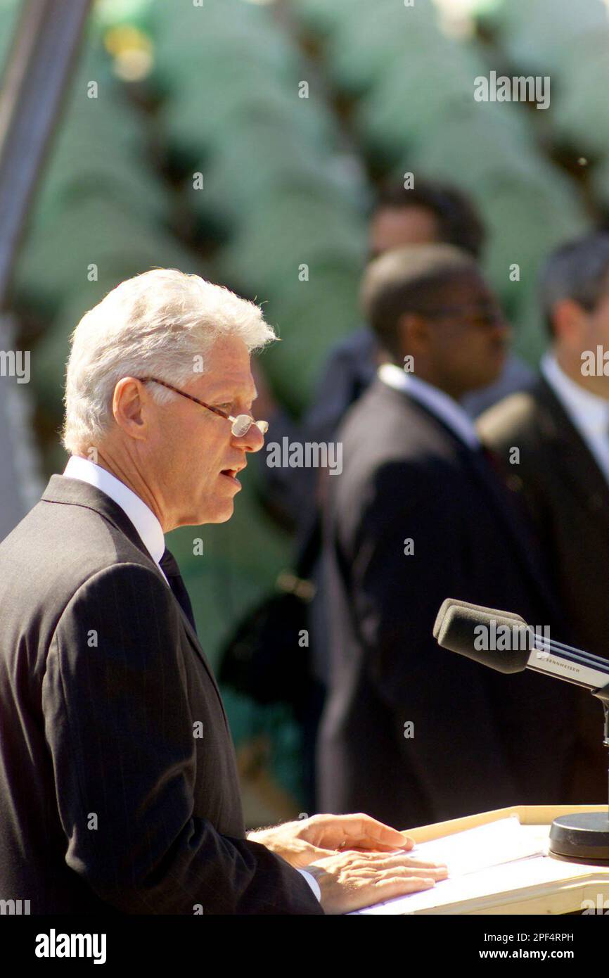 Former U.S. President Bill Clinton gives a speech in front of dozens of ...