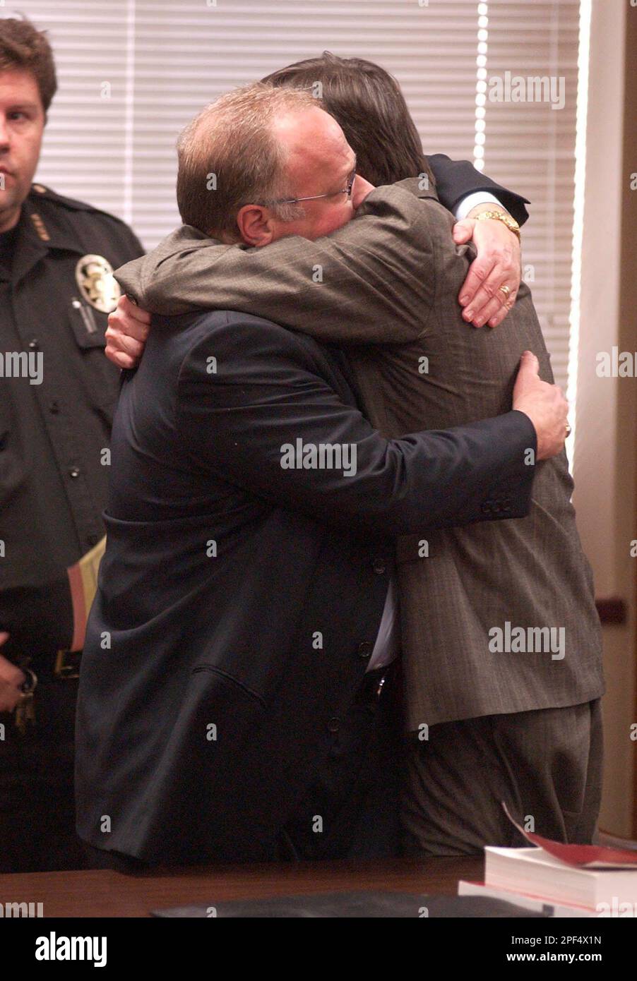 James Pavatt, right, hugs his attorney, Mike after receiving a