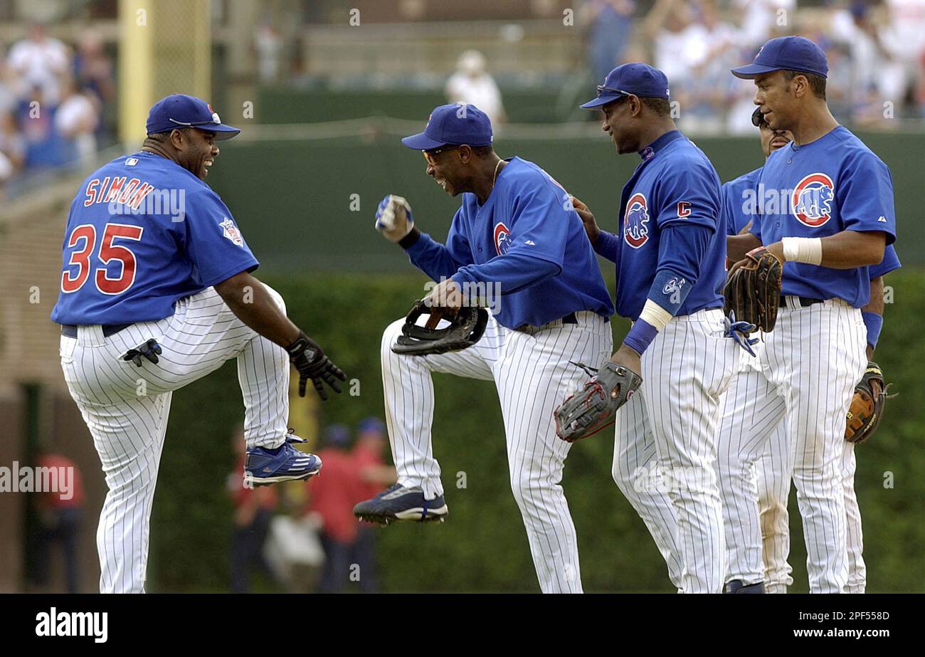 Chicago Cubs' Randall Simon, left and Kenny Lofton, right, laugh