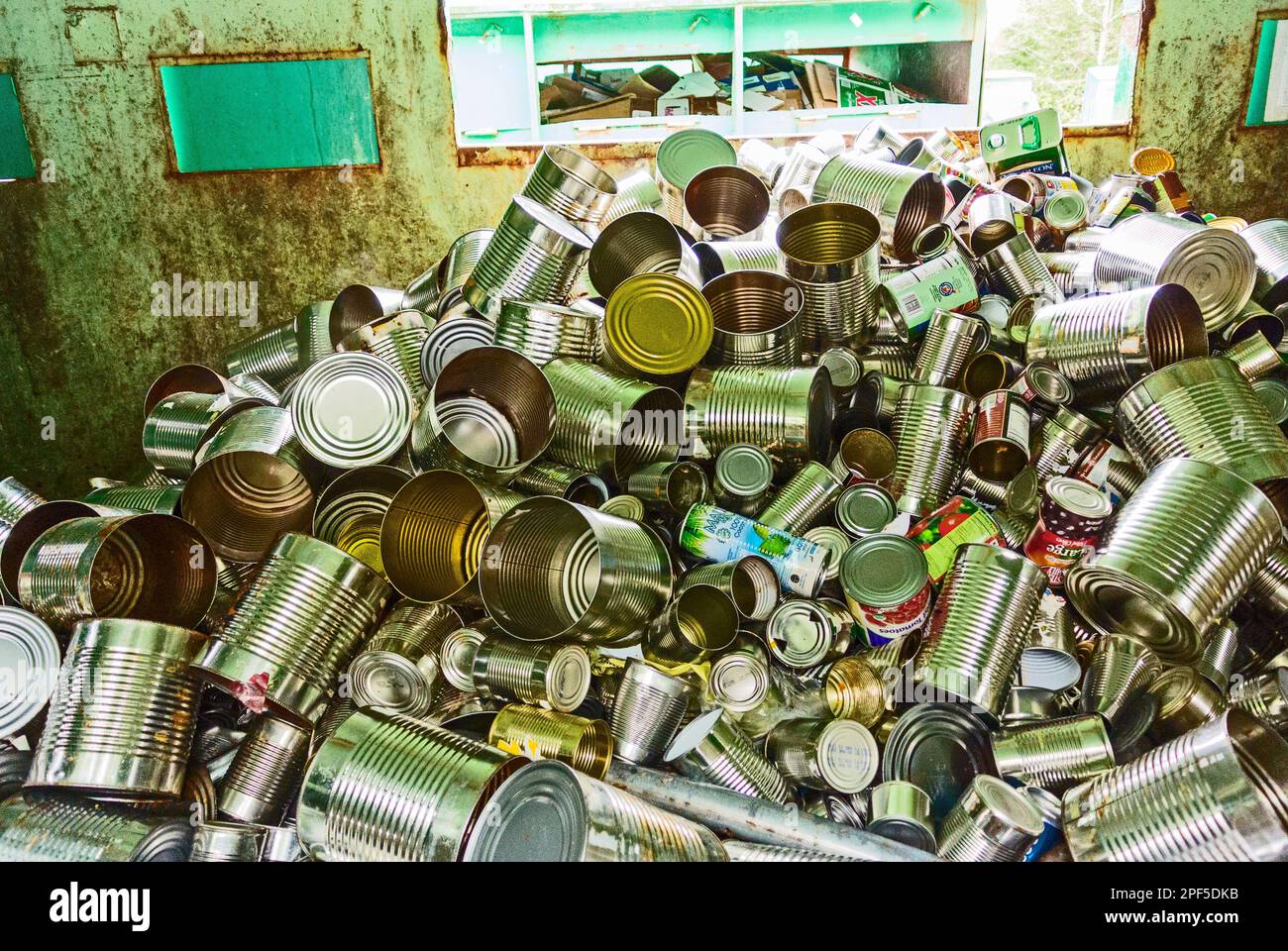 Recycling bin full of tin cans at the recycle collection center in