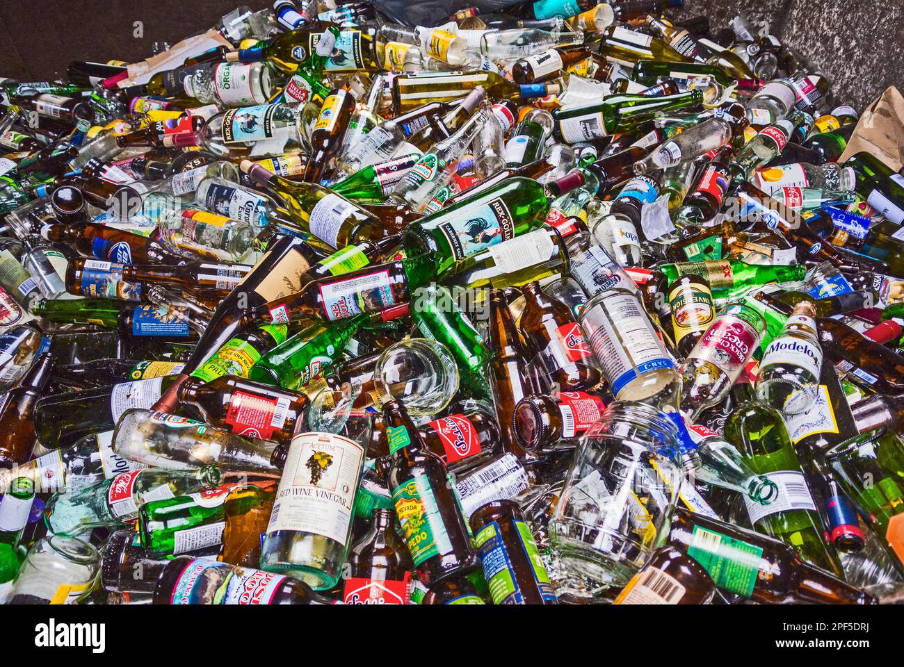 Recycling bin full of beer, wine, liquor and pop bottles at the recycle