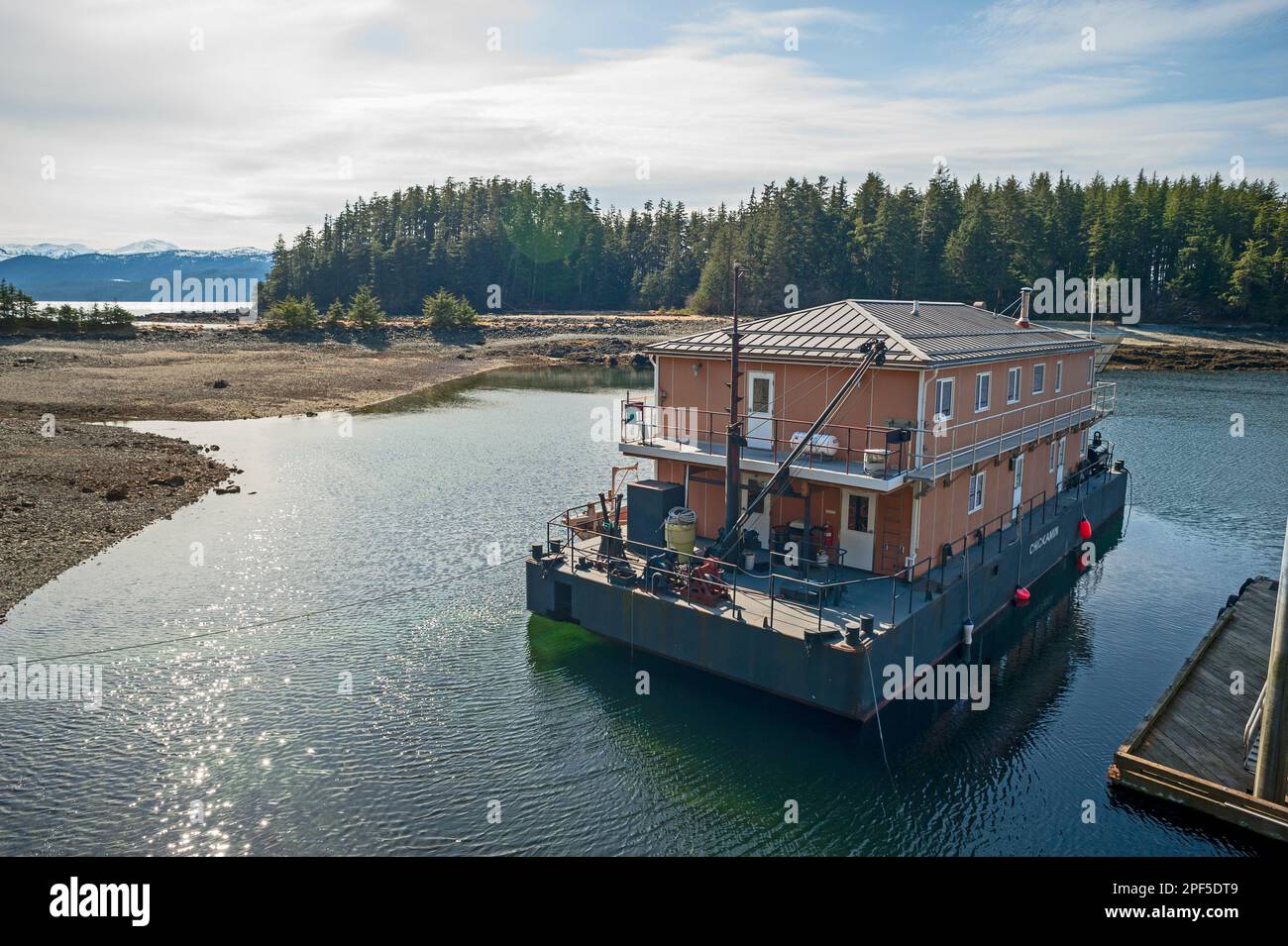 Chickaman barge crew quarters barge docked at False Island work camp on the Tongass National Forest, Alaska, USA. Stock Photo