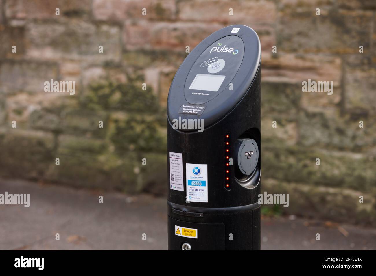 A faulty BP Pulse branded electric vehicle EV charger on the ChargePlace Scotland network operated by the City of Edinburgh Council. Stock Photo