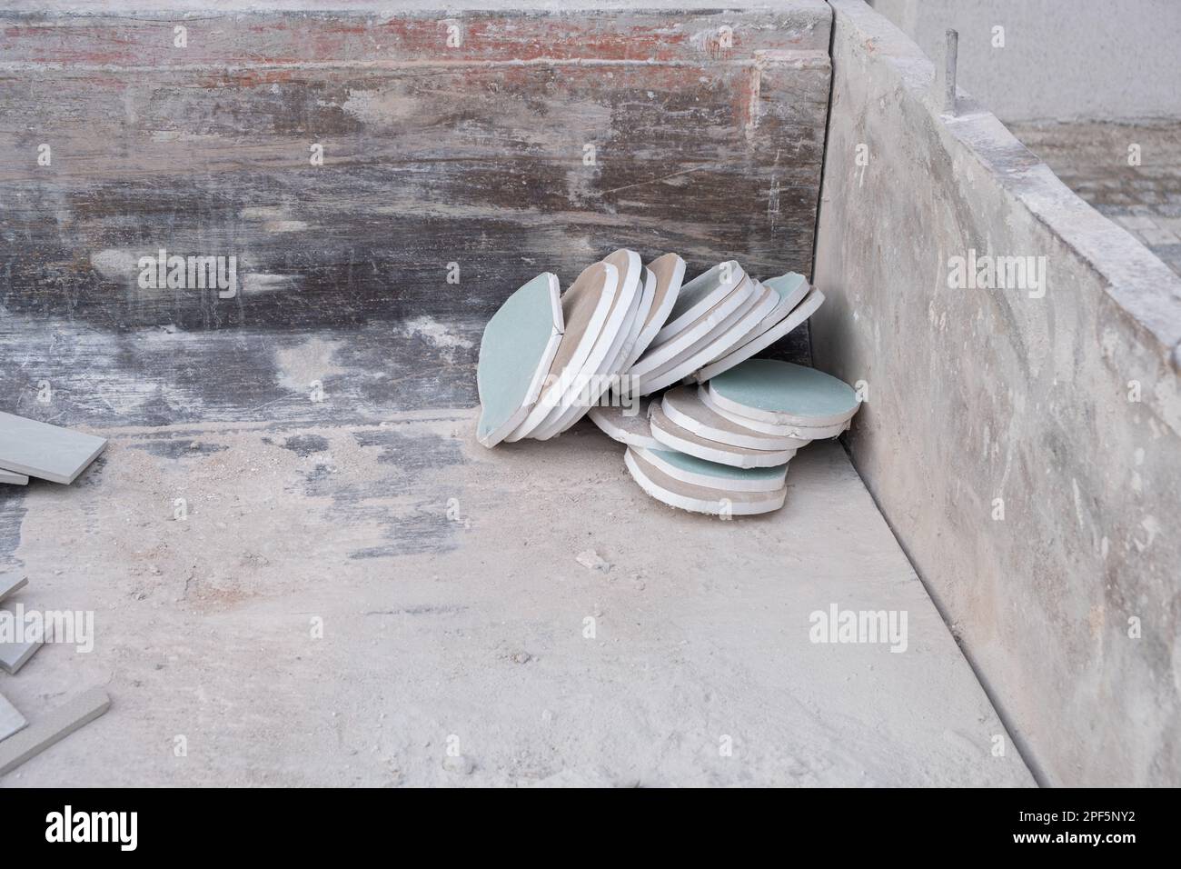 Circular cutted water resistant plasterboard drywall chunks in the