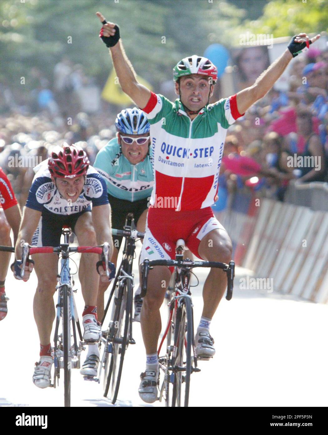 Italy's Olympic champion Paolo Bettini, left, looks at his