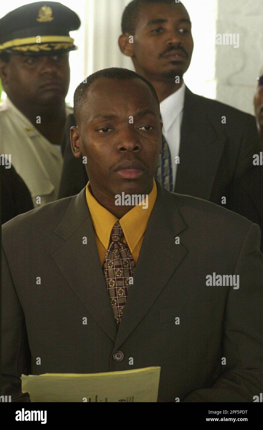 Jean Dady Simeon, ex-spokesman for the Haitian National Police, is seen in  this March 26, 2003 file photo, the day he was fired from his job, during  the swearing in ceremony of