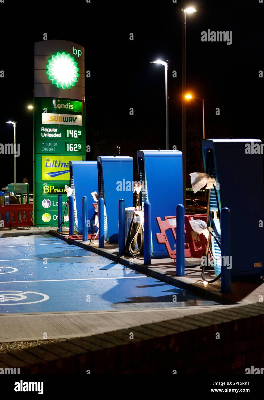 BP EV Electric Vehicle Charging bays being installed at BP service station forecourt - electric car charging points in petrol station forecourts, UK Stock Photo