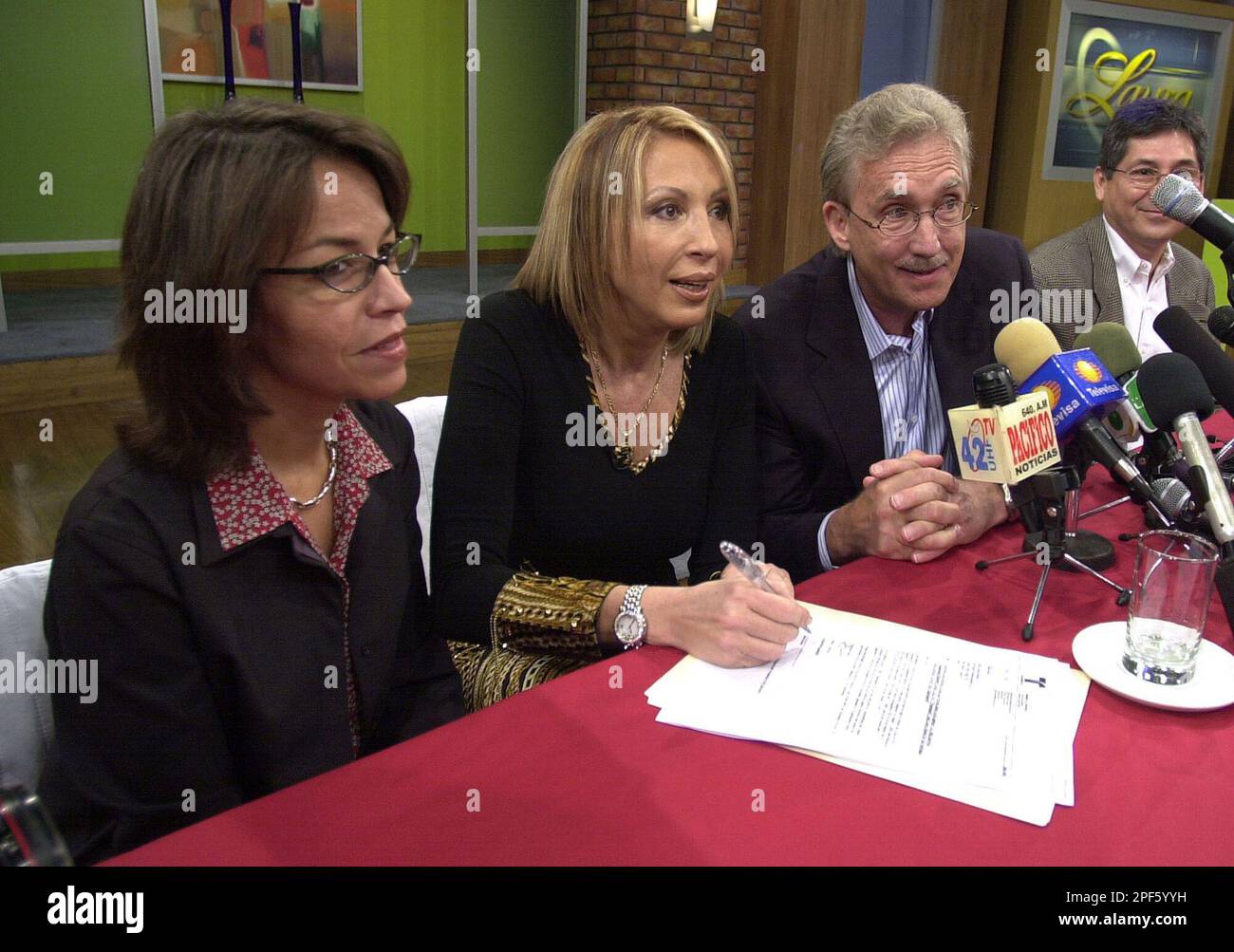 Peruvian television host Laura Bozzo, whose Laura show is a hit on the  U.S. Spanish network Telemundo, shows her passport during a news conference  in Lima, Peru, Wednesday, April 2, 2003. Bozzo