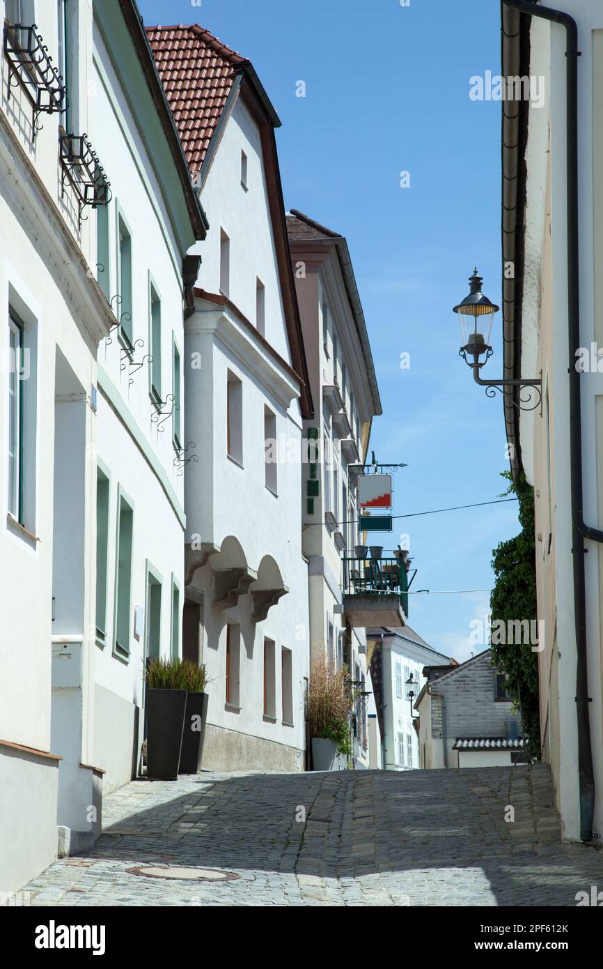 The view of a narrow cobblestone street and old houses in Melk tourist