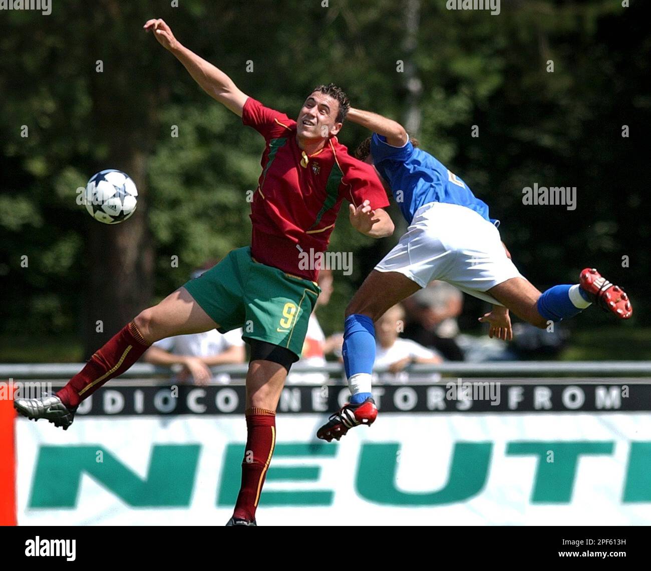 Portugal's Hugo Almeida, left, fights for the ball with Italy's Damiano  Ferronetti, right, during a soccer match of the Uefa U19 European  Championships between Portugal and Italy, Friday, July 18, 2003, in