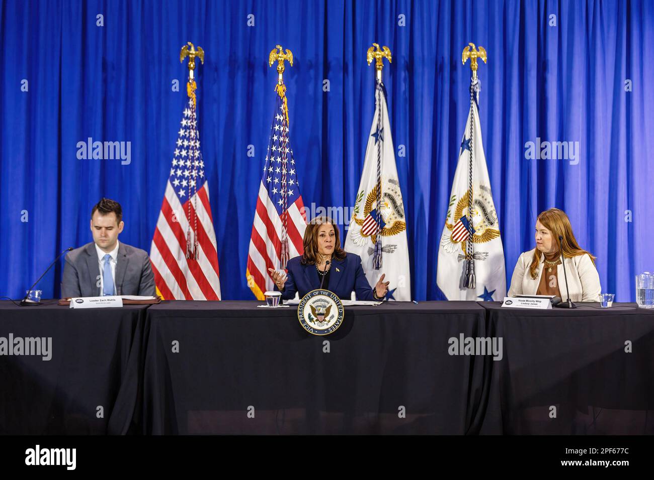 Des Moines, United States. 16th Mar, 2023. State Senator Zach Wahls (D-Coralville, left) and State Representative Lindsay James (D-Dubuque, right) listen as Vice President Kamala Harris (center) speaking. Vice President Kamala Harris held a press conference prior to a roundtable discussion on reproductive rights. Credit: SOPA Images Limited/Alamy Live News Stock Photo