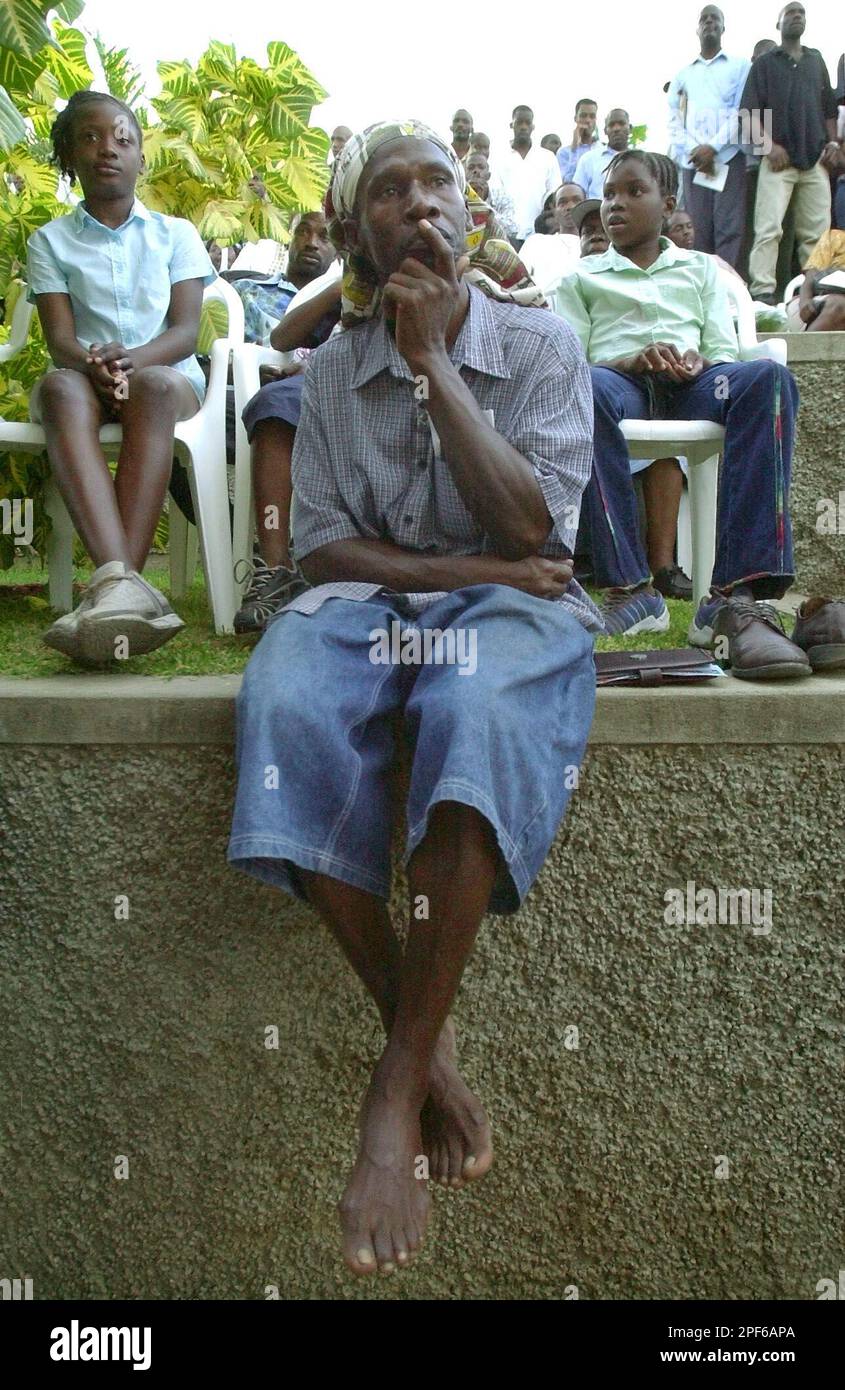 Jamaican Ras Eli listens to South African President Thabo Mbeki after