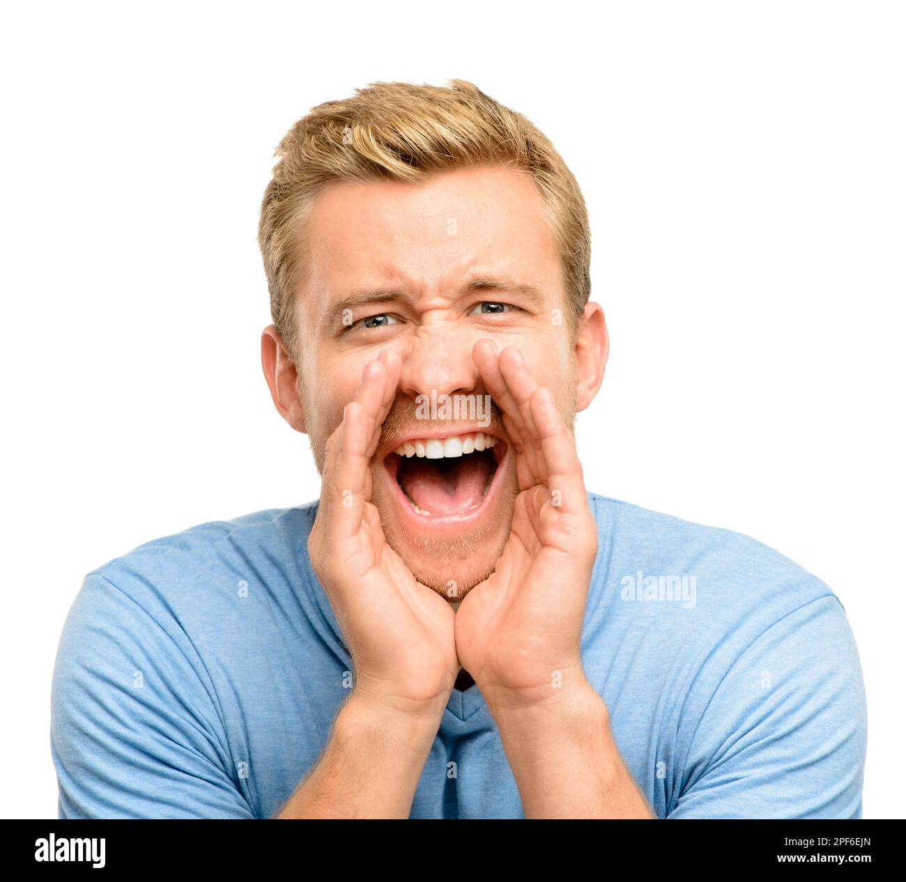 Hey you. a handsome young man standing alone in the studio and shouting