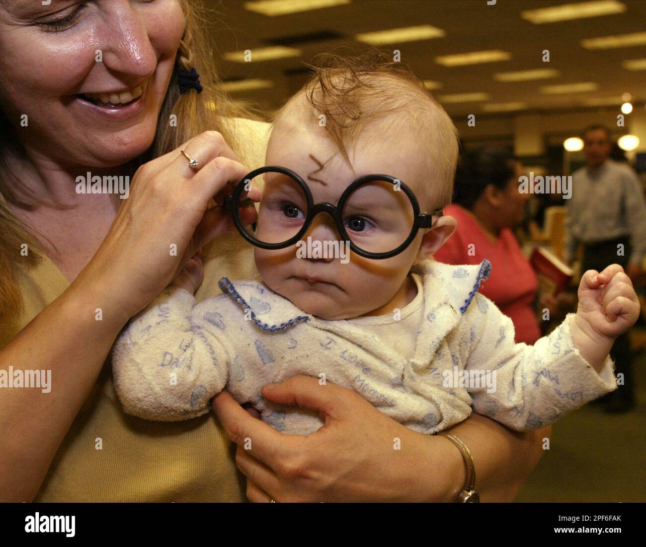 Sixmonthold Rhiannon Braeger is dressed as baby Harry Potter complete