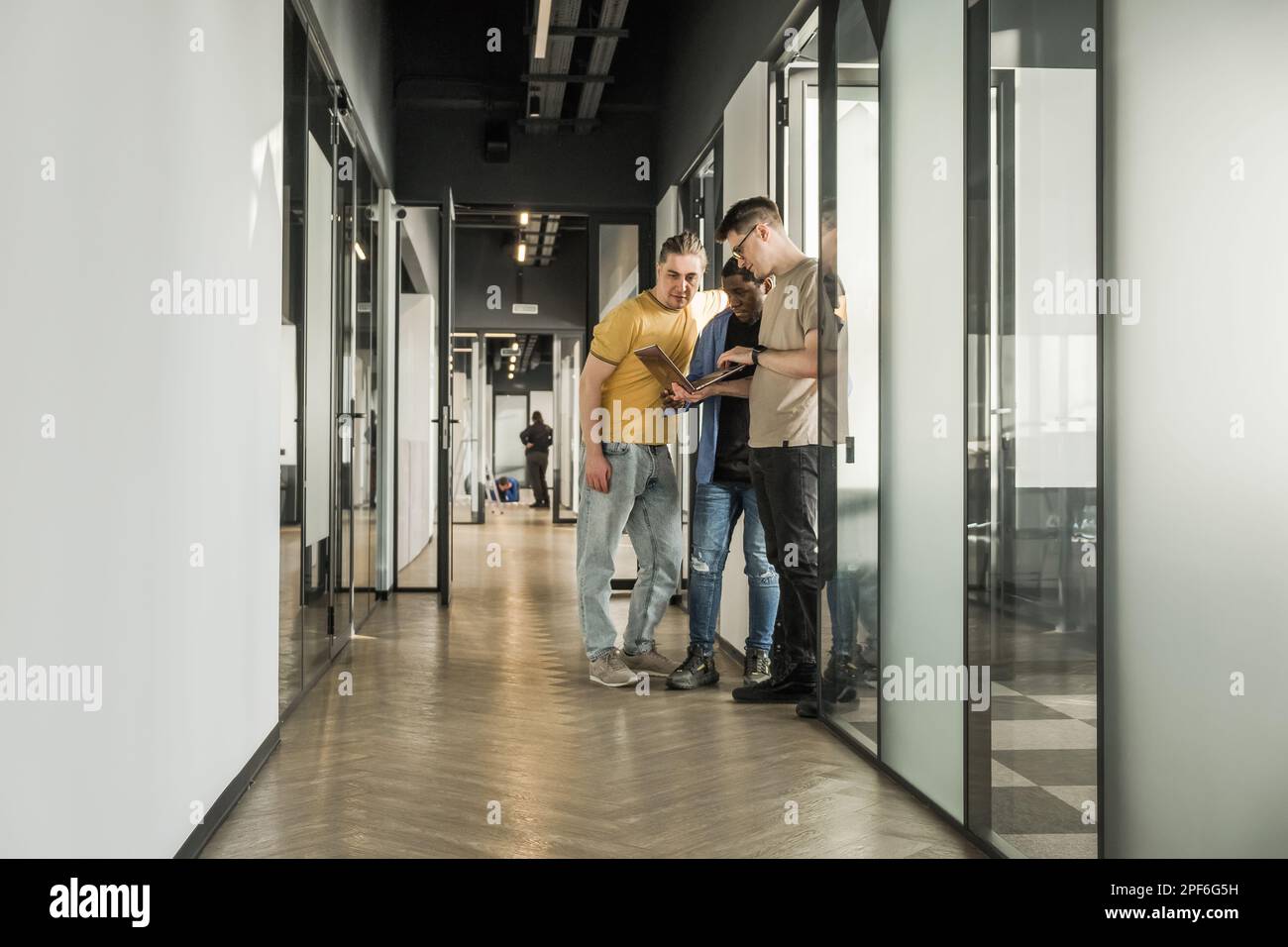 Team is looking for bug fixes in the phone application. Programmers working in the office of a software development company. Coding technologies, site Stock Photo
