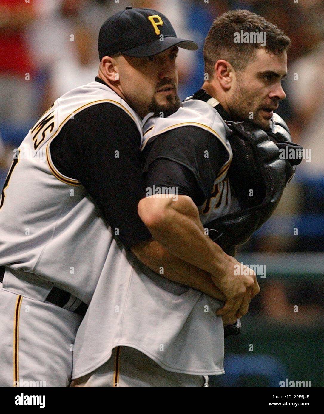 Pittsburgh Pirates pitcher Mike Williams, left, restrains catcher Jason  Kendall during a bench-clearing brawl with the Tampa Bay Devil Rays in the  fourth inning Saturday, June 14, 2003, in St. Petersburg, Fla.