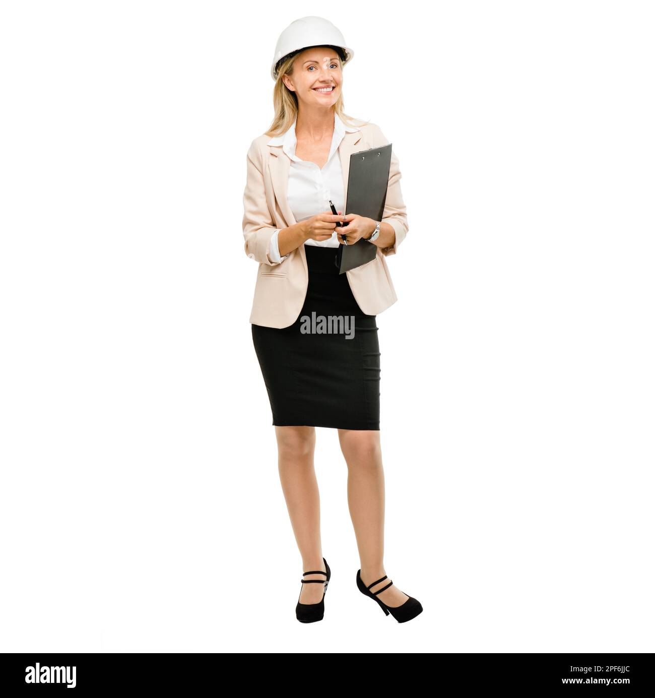 The expert when it comes to engineering. a mature businesswoman checking construction paperwork against a studio background. Stock Photo