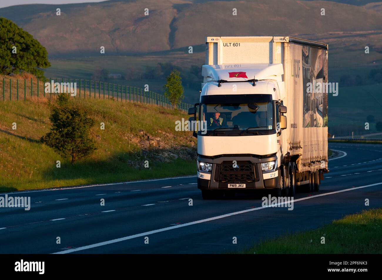Renault truck with dragfoiler and aerodynamic trailer driving along the M74 in Scotland Stock Photo
