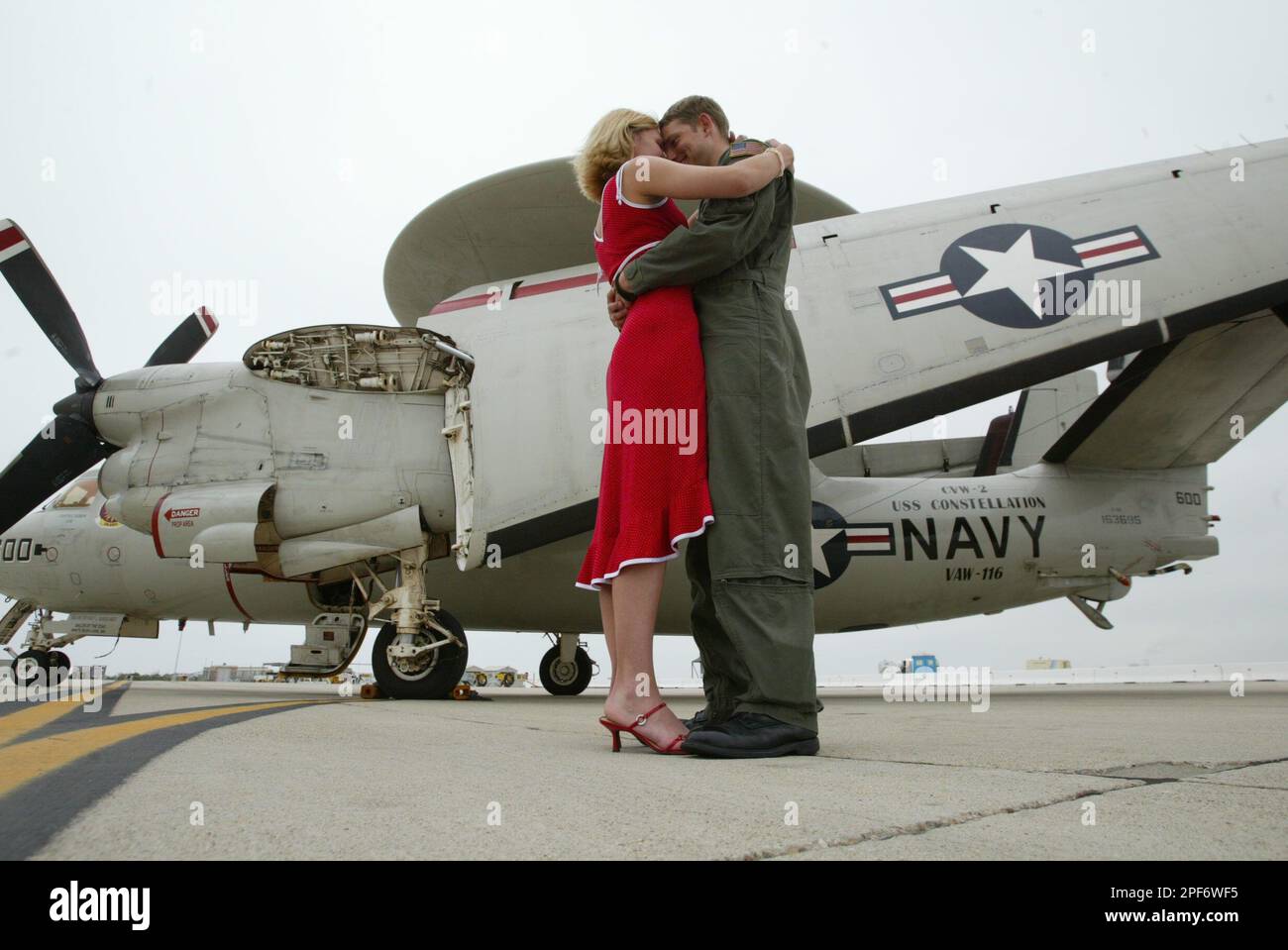 Navy E-2c Hawkeye pilot Dave Champaigne, right, hugs his girlfriend ...