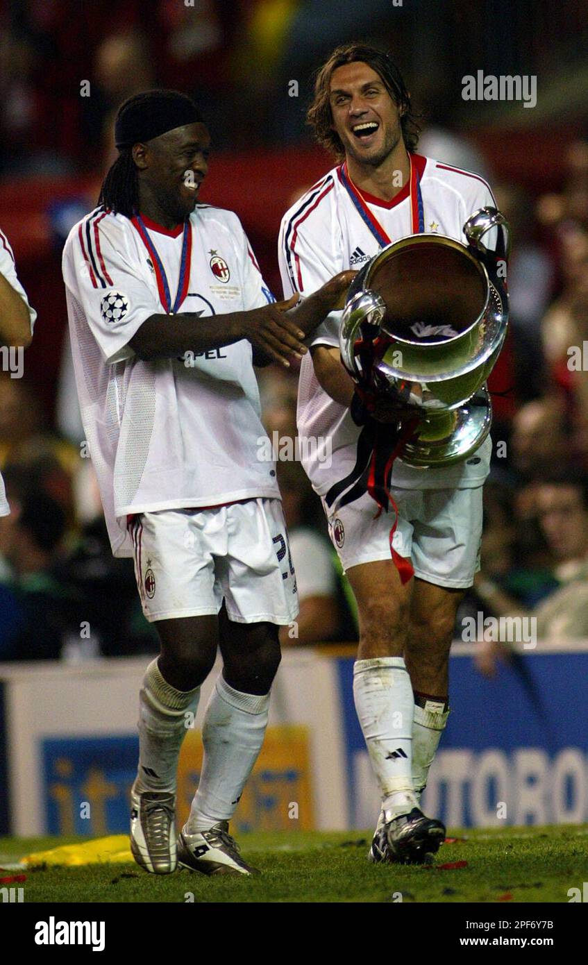 AC Milan's Clarence Seedorf, left, and Paolo Maldini celebrate