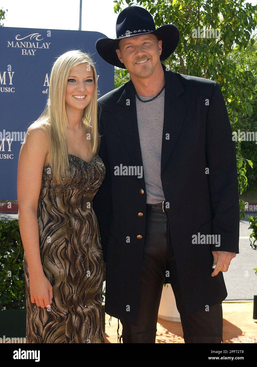 Country star Trace Adkins, right, escorts his 18 year old daughter, Tarah Adkins, as they arrive
