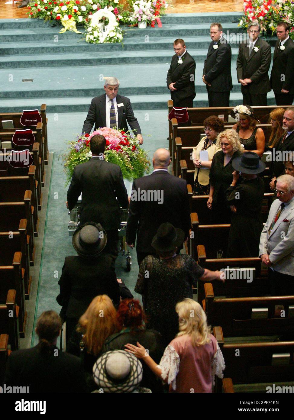 Family members of June Carter Cash follow her casket during ...