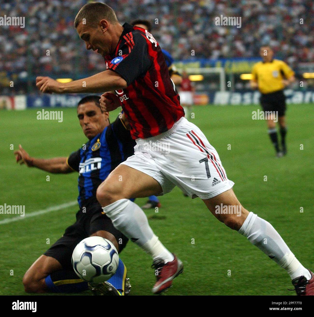 A.C.Milan forward Andriy Shevchenko of Ukraine , right, challenges for the  ball with Inter Milan 's Ivan Ramiro Cordoba, of Colombia, during Champions  League second leg semifinal soccer match at the San