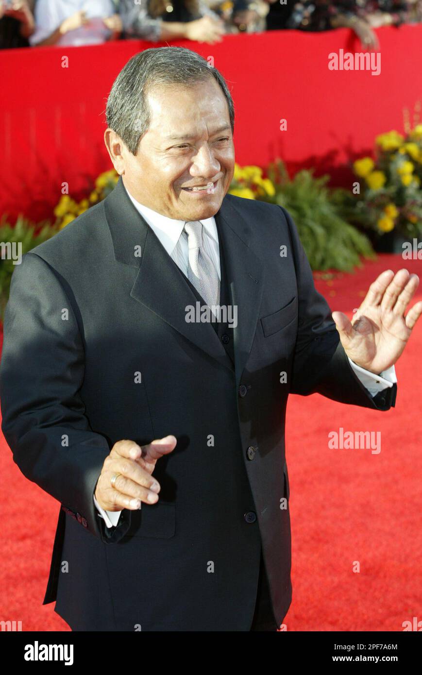 Mexican singer and composer Armando Manzanero waves as he arrives