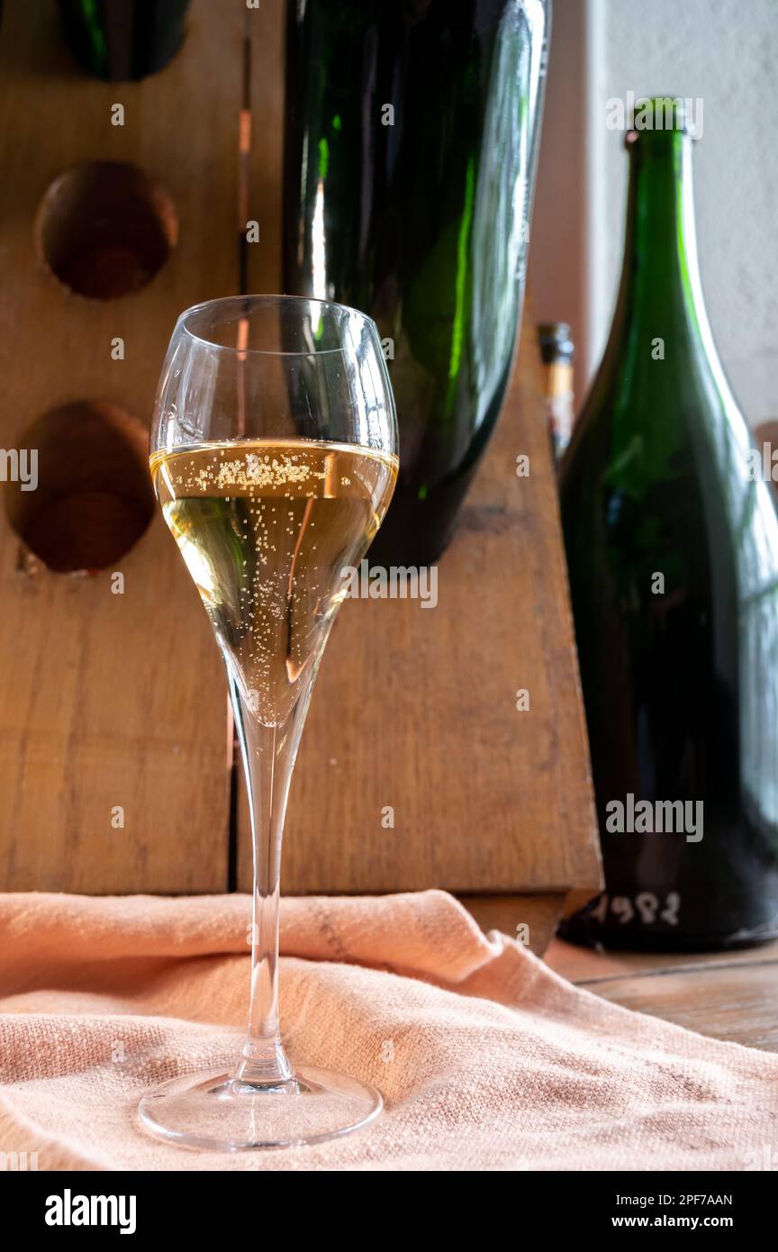 Glass of sparkling white wine champagne gran cru or cava with bubbles