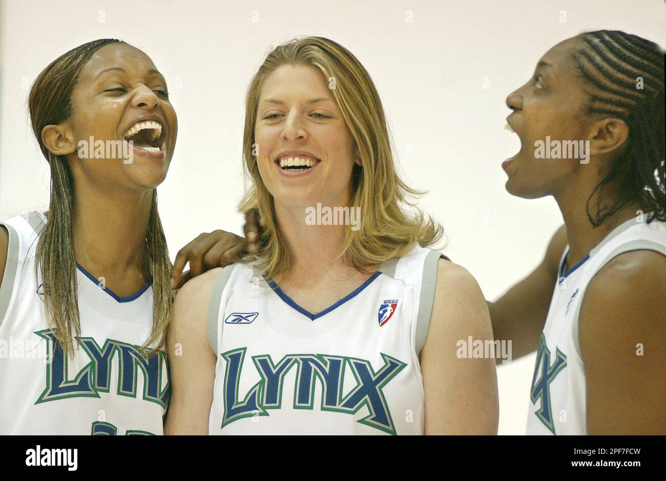 Minnesota Lynx forward Tamika Williams, left, guard Katie Smith