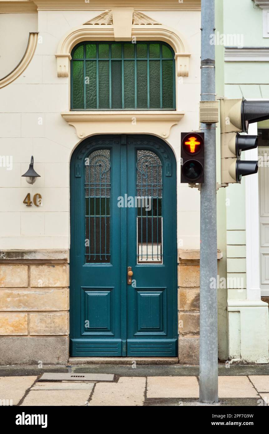 View of old building with blue wooden door Stock Photo - Alamy