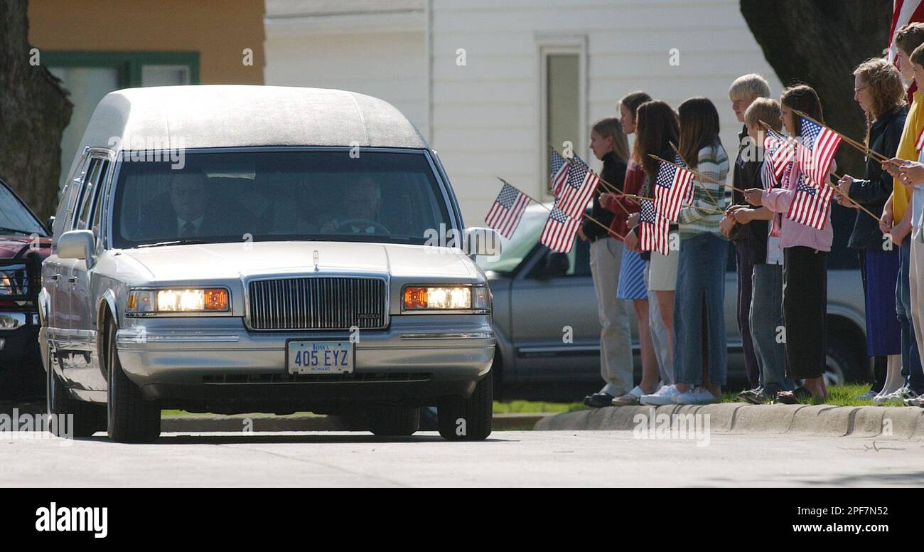 The funeral procession of Marine Gunnery Sgt. Jeffrey Bohr is greeted
