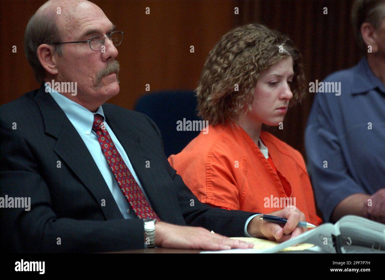 Sarah Dutra, who was convicted of manslaughter in the killing of Woodbridge  attorney Larry McNabney listens to her attorney Kevin Clymo, left, ask the  judge for mercy at her sentencing hearing in