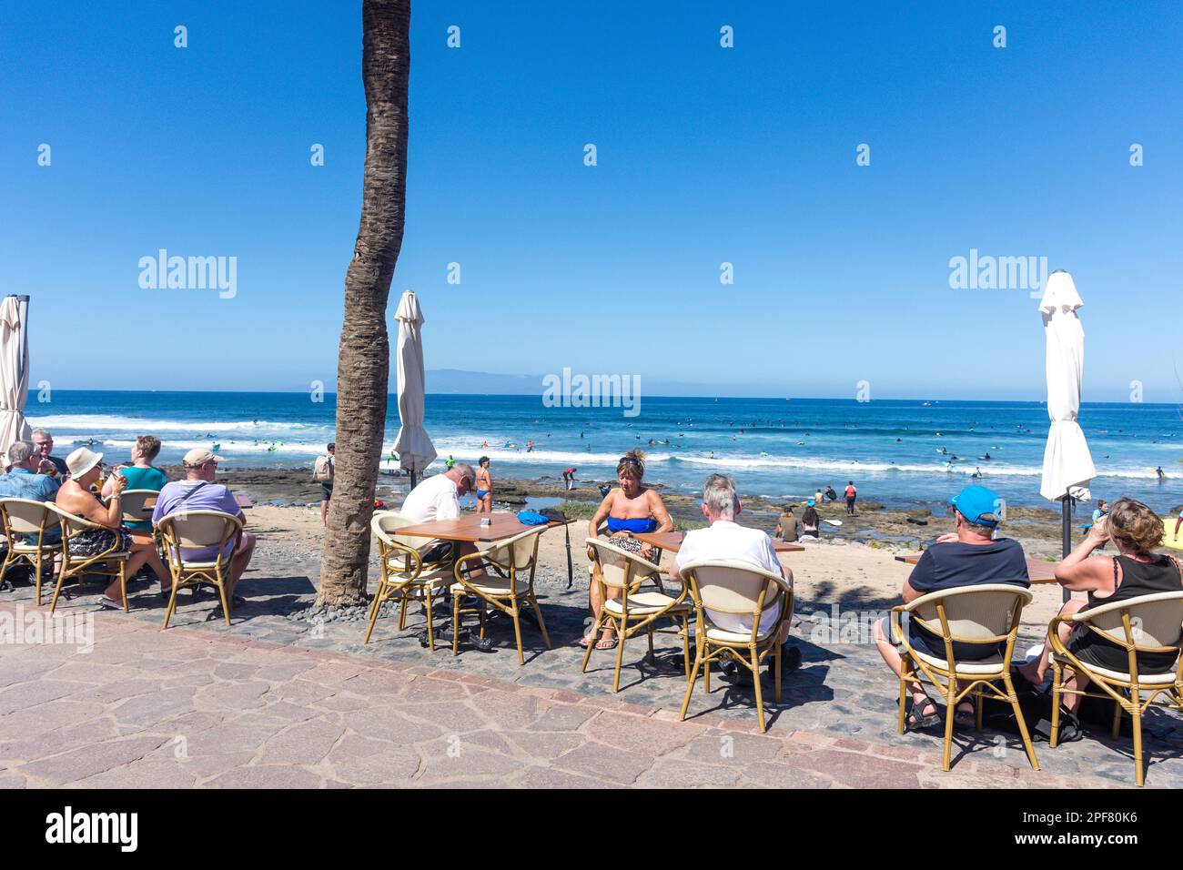 Restaurant tables on beach promenade, Calle Francisco Andrade Fumero, Playa de las Américas, Tenerife, Canary Islands, Kingdom of Spain Stock Photo