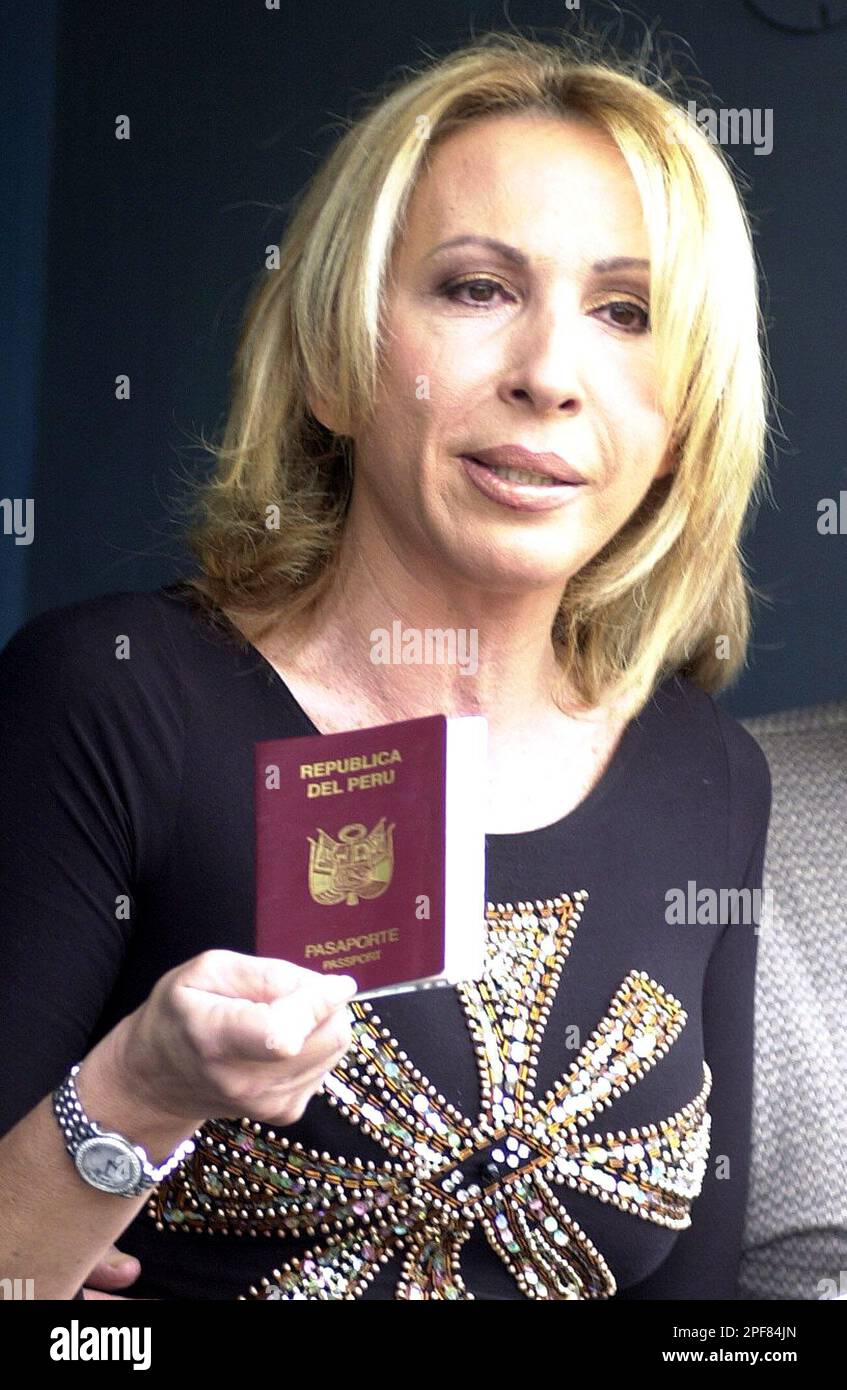 Peruvian television host Laura Bozzo, whose Laura show is a hit on the  U.S. Spanish network Telemundo, shows her passport during a news conference  in Lima, Peru, Wednesday, April 2, 2003. Bozzo