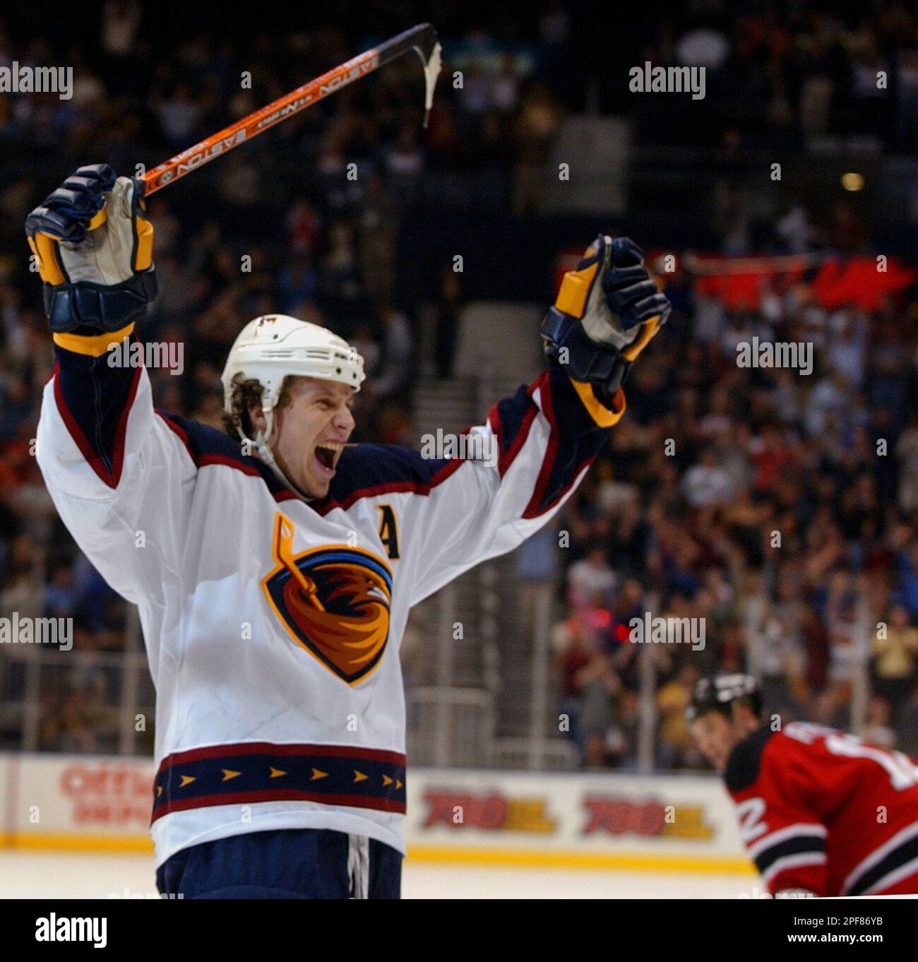 Atlanta Thrashers right wing Dany Heatley, right, hits the puck away from  Pittsburgh Penguins center Mike Eastwood on Friday, April 2, 2004, in  Atlanta. (AP Photo/Matt Roth Stock Photo - Alamy