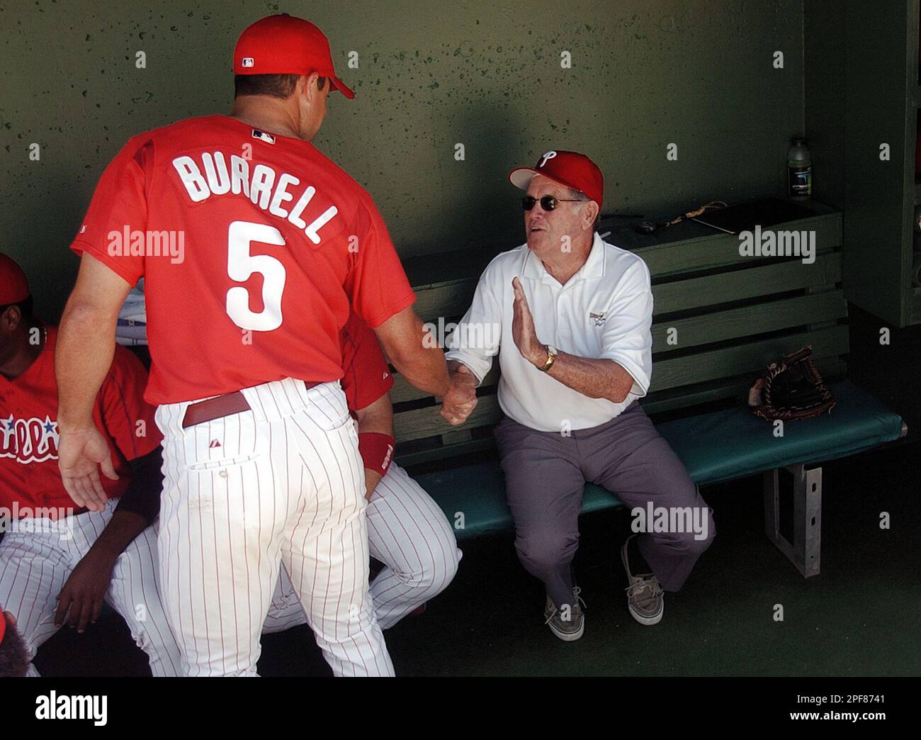 Philadelphia Phillies Hall of Fame pitcher Robin Roberts, right, talks with  Phillies outfielder Pat Burrell (5) before the start of a game with the New  York Yankees Friday afternoon, March 28, 2003