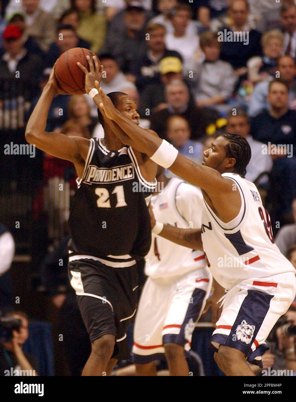 Providence's Marcus Douthit looks for a teammate to pass to as