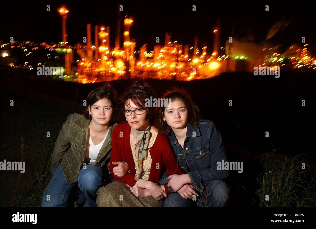Allison Vogel is flanked by her daughters Whitney Harker, left, and