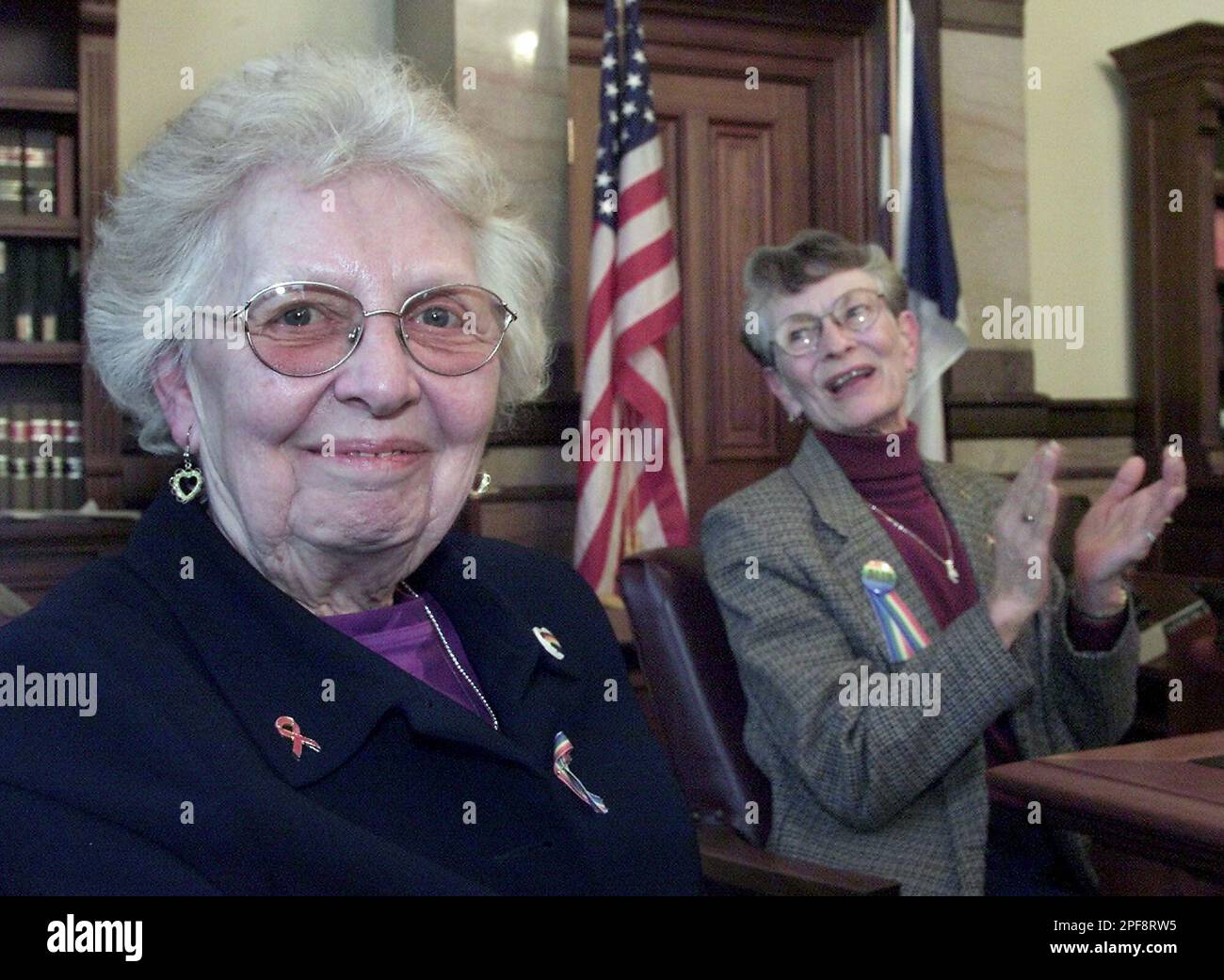 Carolyn Jones, left, of Independence, Iowa, and Jean Huffey, right, of  Waterville, Iowa, both of whom have sons that are gay, listen to other  parents stories at a public forum held at