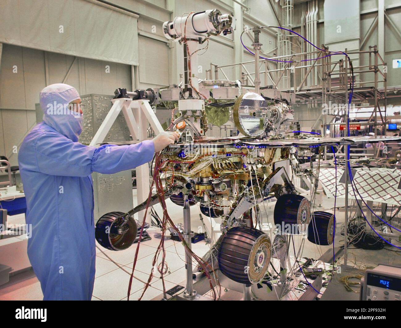Senior mechanical systems engineer Paul V. Hardy stands next to a