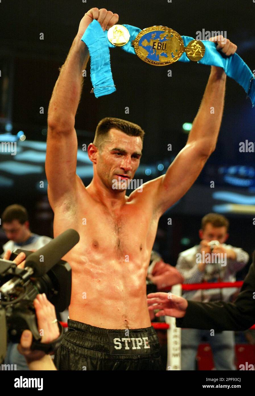 German boxer Stipe Drews presents the winners belt after he won the  European Championship light-heavyweight title-fight of the European Boxing  Union (EBU) against Italian boxer Silvio Branco in Berlin, late Saturday  evening,