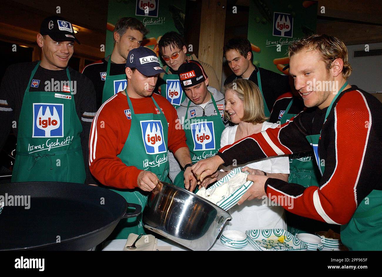 Austrian skiers from left: Michael Walchhofer, Mario Matt, Stephan  Eberharter, Rainer Schoenfelder, Benjamin Raich, Heinz Schilchegger and  Hermann Maier help Johanna Maier, 2nd right, the cook at the Austria House  in St.