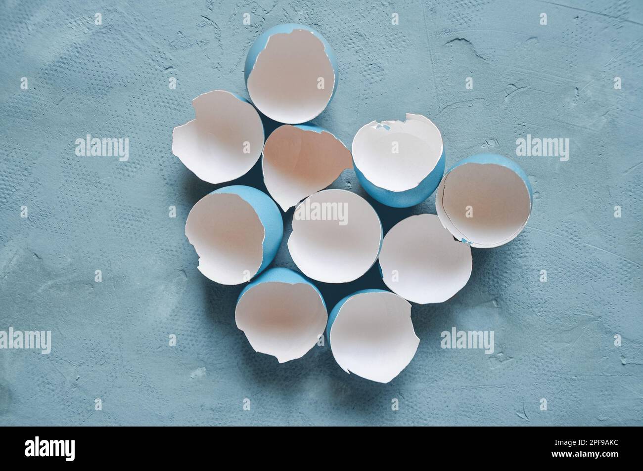 Broken Easter egg. Colored eggs. Cracked shell. Happy Easter springtime background Stock Photo