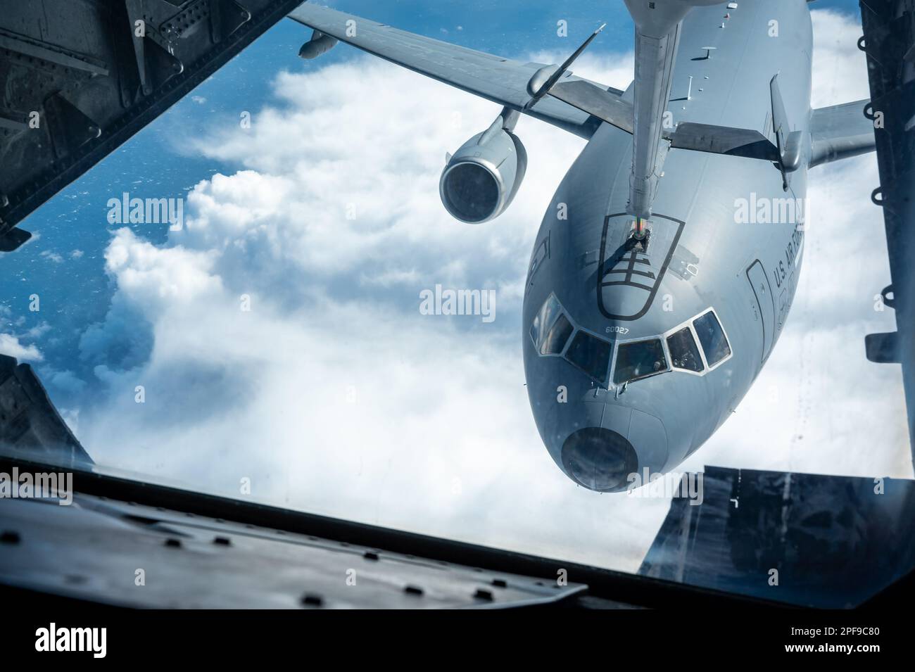 A KC-10 Extender, from the 79th Air Refueling Squadron, attaches to a boom during a simulated refueling training mission over the Pacific Ocean, February 24, 2023. The 79ARS conducted refueling training with KC-10s assigned to Travis Air Force Base, California. (U.S. Air Force photo by Tech. Sgt. Daniel Peterson) Stock Photo