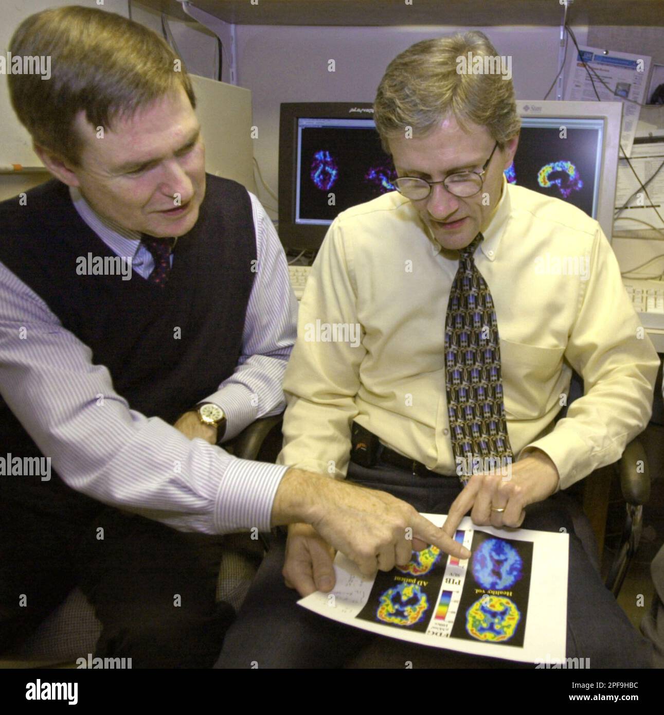 Psychiatrist Dr. William Klunk, right, and Chester Mathis, a ...