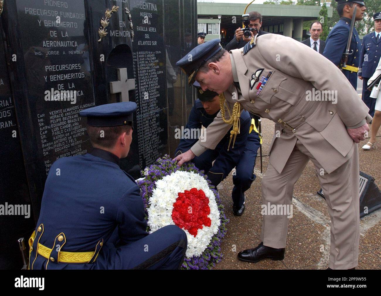 British Air Force Chief, Air Gen. Peter Squire, places a wreath of ...