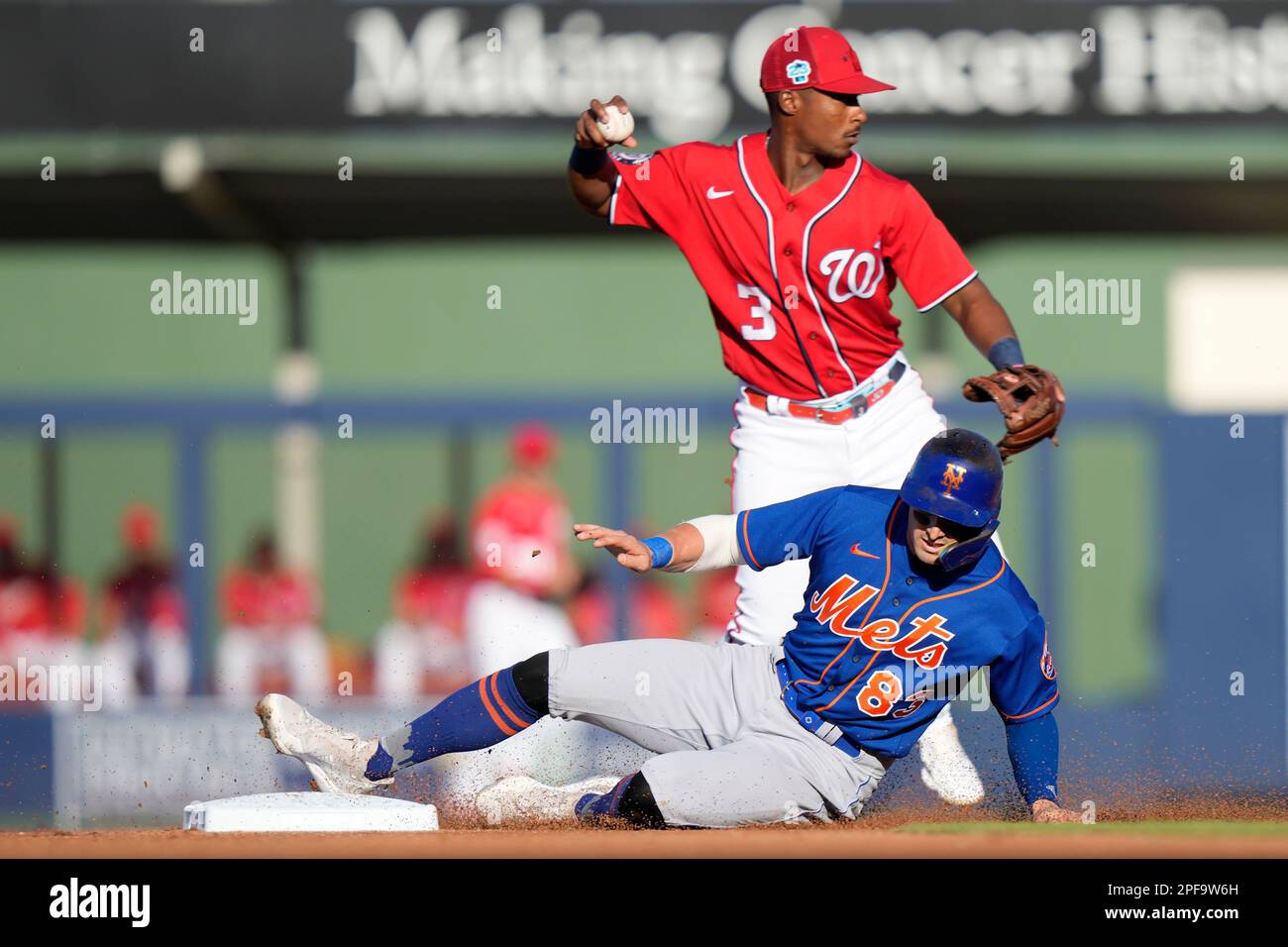 New York Mets' Tim Locastro (83) is out at second as Washington