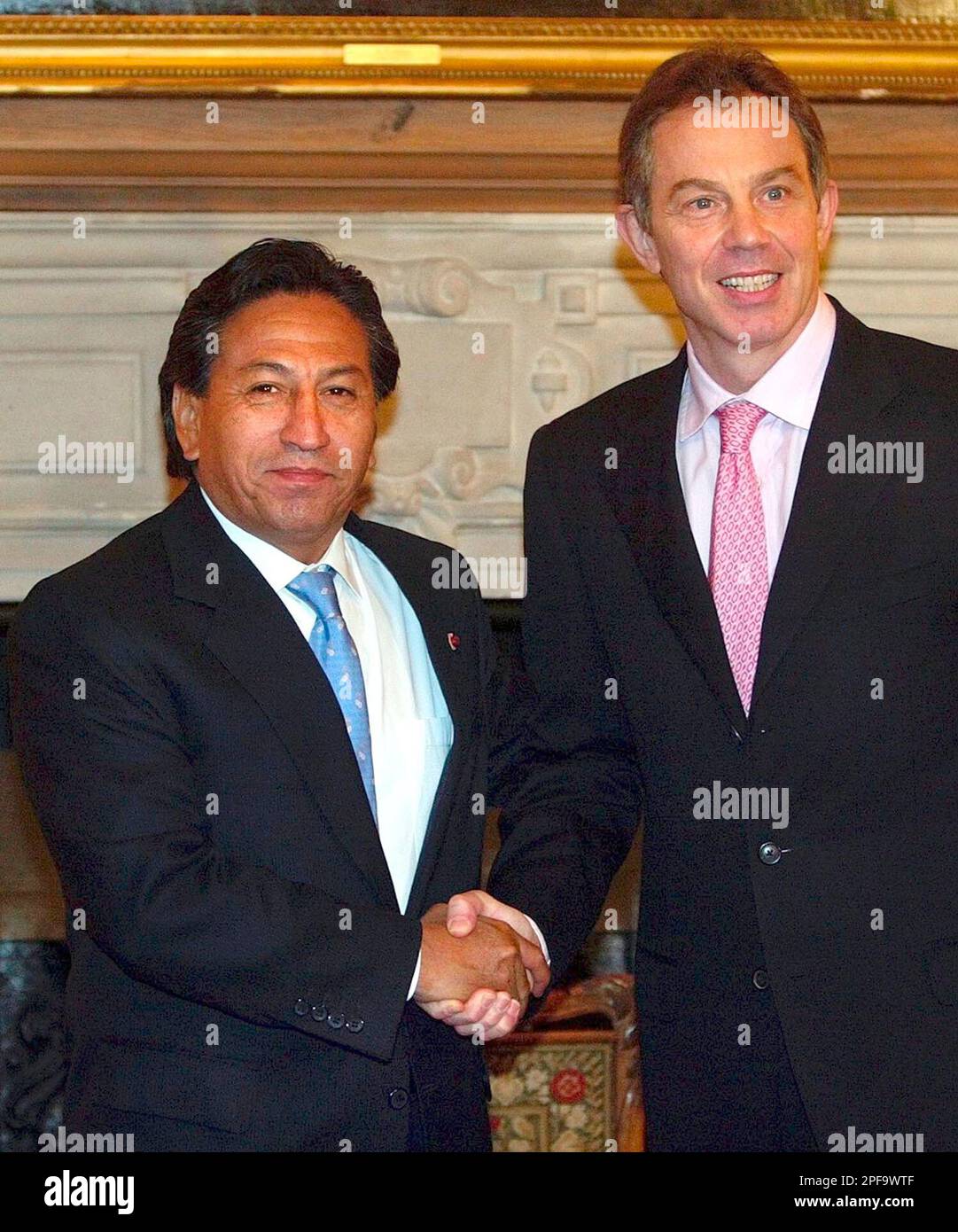 The British Prime Minister Tony Blair, right, greets the Peruvian